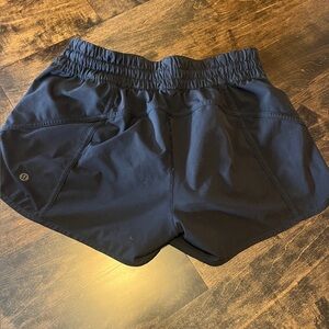 Lululemon track that high-rise black shorts. Size 8.